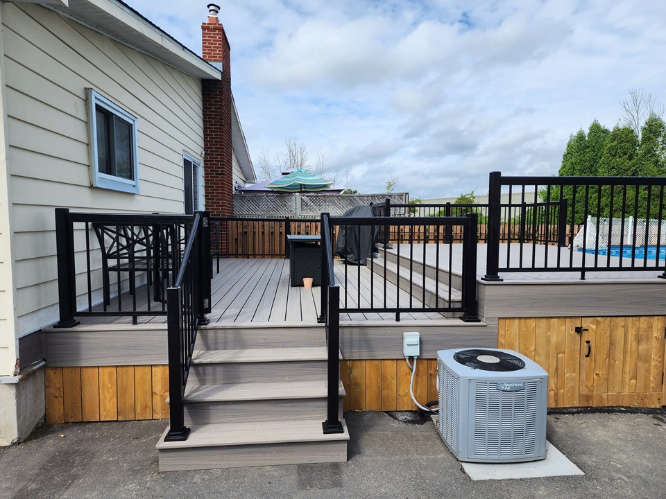 Exterior Service Deck around pool using trex decking plus railing - POIRIER RENOVATIONS