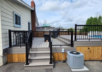 Exterior-Service-Deck-around-pool-using-trex-decking-plus-railing-POIRIER-RENOVATIONS