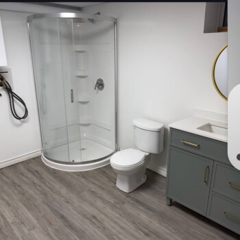 Interior Renovations Bathroom. New floor, shower, toliet and sink.