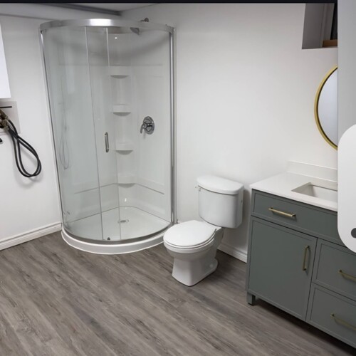 Interior Renovations Bathroom. New floor, shower, toliet and sink.